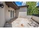 A tiled patio offers a private and relaxing outdoor living space with easy access to the home's interior at 7162 Graybrook Dr, Wesley Chapel, FL 33545
