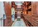 Spacious walk-in closet with custom shelving and ample storage at 7162 Graybrook Dr, Wesley Chapel, FL 33545