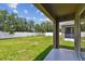 A view of the backyard featuring a covered patio and vinyl fencing at 8020 Carriage Pointe Dr, Gibsonton, FL 33534