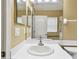 Clean bathroom features a mirrored vanity, a toilet, and a door that fills the space with natural light at 8020 Carriage Pointe Dr, Gibsonton, FL 33534