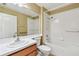 Bright bathroom with mirrored vanity and bathtub shower at 8020 Carriage Pointe Dr, Gibsonton, FL 33534