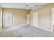 Inviting bedroom featuring a ceiling fan, balcony access, and ample closet space at 8020 Carriage Pointe Dr, Gibsonton, FL 33534
