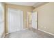 Inviting carpeted bedroom showcasing closet and entry to laundry room at 8020 Carriage Pointe Dr, Gibsonton, FL 33534