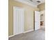 Bright bedroom with closet, carpeted floors and bathroom access at 8020 Carriage Pointe Dr, Gibsonton, FL 33534