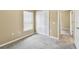 Comfortable bedroom with carpet, large window, and closet at 8020 Carriage Pointe Dr, Gibsonton, FL 33534