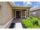 Welcoming entryway with a brick-lined porch and manicured landscaping at 8020 Carriage Pointe Dr, Gibsonton, FL 33534