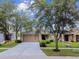 Charming single-story home with a well-manicured lawn and inviting curb appeal at 8020 Carriage Pointe Dr, Gibsonton, FL 33534