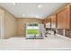 Functional kitchen with white appliances and a view of the backyard at 8020 Carriage Pointe Dr, Gibsonton, FL 33534