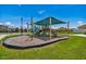 Community playground with climbing and slide features, perfect for Gathering fun at 8020 Carriage Pointe Dr, Gibsonton, FL 33534