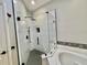 Modern bathroom with glass shower, subway tile, and a soaking tub at 824 Lantern Way, Clearwater, FL 33765