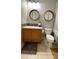 Cozy bathroom with modern fixtures, wood mirror frames, and decorative tile backsplash at 824 Lantern Way, Clearwater, FL 33765