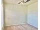 Unfurnished bedroom with neutral paint, ceiling fan, carpeted flooring, and natural light at 824 Lantern Way, Clearwater, FL 33765