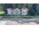 The Coachman Reserve community sign featuring attractive architecture and landscaping at 824 Lantern Way, Clearwater, FL 33765