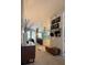 Hallway leading to an open kitchen with an island and a cozy living room at 824 Lantern Way, Clearwater, FL 33765