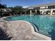 Community pool with ample seating and shaded pergolas at 824 Lantern Way, Clearwater, FL 33765