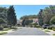 Serene street view highlighting the neighborhood's well-manicured lawns and beautiful homes, creating a welcoming atmosphere at 824 Lantern Way, Clearwater, FL 33765