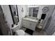 Updated bathroom with granite counter, vanity, and decorative ship wheel accessories at 8630 Mallard Reserve Dr # 105, Tampa, FL 33614