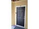 The front door has a black finish, number 105 displayed above and a sleek doorbell at 8630 Mallard Reserve Dr # 105, Tampa, FL 33614