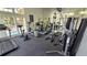 Fitness center with modern exercise equipment and floor to ceiling mirrors, overlooking the pool at 8630 Mallard Reserve Dr # 105, Tampa, FL 33614