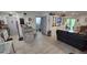 Open floor plan living room area leading to the kitchen with granite counters and stainless appliances at 8630 Mallard Reserve Dr # 105, Tampa, FL 33614