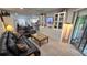 This living room features two couches, a built-in entertainment center, and sliding glass doors at 8630 Mallard Reserve Dr # 105, Tampa, FL 33614