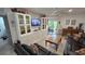 Comfortable living room features built in cabinetry and a sliding glass door leading to the outdoor patio at 8630 Mallard Reserve Dr # 105, Tampa, FL 33614