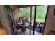 A covered patio with sliding glass door. This outdoor area offers lots of plants at 8630 Mallard Reserve Dr # 105, Tampa, FL 33614