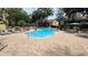Swimming pool and deck area with multiple seating options for the community residents at 8630 Mallard Reserve Dr # 105, Tampa, FL 33614