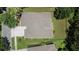 Aerial top view of the home displaying the roof and landscaping at 8704 Winsome Way, Land O Lakes, FL 34637