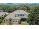 Aerial view of a house with screened patio in a mature neighborhood at 8704 Winsome Way, Land O Lakes, FL 34637