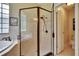 Walk-in shower in bathroom with tile backsplash and a bathtub that has tile surround at 8704 Winsome Way, Land O Lakes, FL 34637