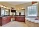 Bathroom featuring a soaking tub, vanity with granite countertops, a TV, and decorative lighting at 8704 Winsome Way, Land O Lakes, FL 34637
