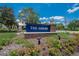 Elegant community sign surrounded by lush landscaping, creating a welcoming entrance to The Arbors at 8704 Winsome Way, Land O Lakes, FL 34637