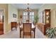 Formal dining area boasts tile floors, a decorative cabinet, and seating for eight at 8704 Winsome Way, Land O Lakes, FL 34637