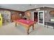 Spacious game room with pool table, library, and movie posters for entertainment at 8704 Winsome Way, Land O Lakes, FL 34637