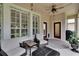 Covered lanai with comfortable seating and views of the outdoors at 8704 Winsome Way, Land O Lakes, FL 34637
