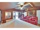 Cozy movie room with comfortable seating, projector, and movie memorabilia at 8704 Winsome Way, Land O Lakes, FL 34637