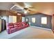 Home theater room featuring plush seating, a projector, and an acoustic panel ceiling at 8704 Winsome Way, Land O Lakes, FL 34637