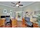 Spacious office with hardwood floors, dual desks, and French doors leading to the foyer at 8704 Winsome Way, Land O Lakes, FL 34637