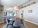 Dining area showcasing a round table with four chairs and decorative baskets above at 8717 Persea Ct, Trinity, FL 34655