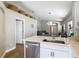Kitchen view with modern appliances, and view to open living area at 8717 Persea Ct, Trinity, FL 34655