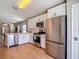 Kitchen with stainless steel refrigerator, oven and microwave at 8717 Persea Ct, Trinity, FL 34655