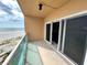 Balcony view featuring sliding glass doors with ocean view at 880 Mandalay Ave # N311, Clearwater Beach, FL 33767