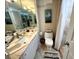 Bathroom featuring toilet, marbled countertops and vanity at 880 Mandalay Ave # N311, Clearwater Beach, FL 33767