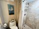 Cozy bathroom featuring shower with white curtain and decor at 880 Mandalay Ave # N311, Clearwater Beach, FL 33767
