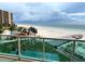 Beautiful beach view from the balcony of this condo with pool, shuffleboard court, and pier at 880 Mandalay Ave # N311, Clearwater Beach, FL 33767