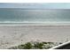 Close up beach view showcasing beautiful white sand and clear water at 880 Mandalay Ave # N311, Clearwater Beach, FL 33767