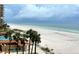 Overlooking the beach from a condo, offering a scenic view of the ocean and shoreline at 880 Mandalay Ave # N311, Clearwater Beach, FL 33767
