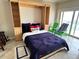 Murphy bed with built-ins and balcony access; stylish and space saving design at 880 Mandalay Ave # N311, Clearwater Beach, FL 33767