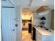 Cozy kitchenette with wine rack over breakfast bar at 880 Mandalay Ave # N311, Clearwater Beach, FL 33767